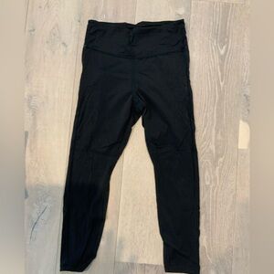 Athleta black 7/8 legging with side pockets.